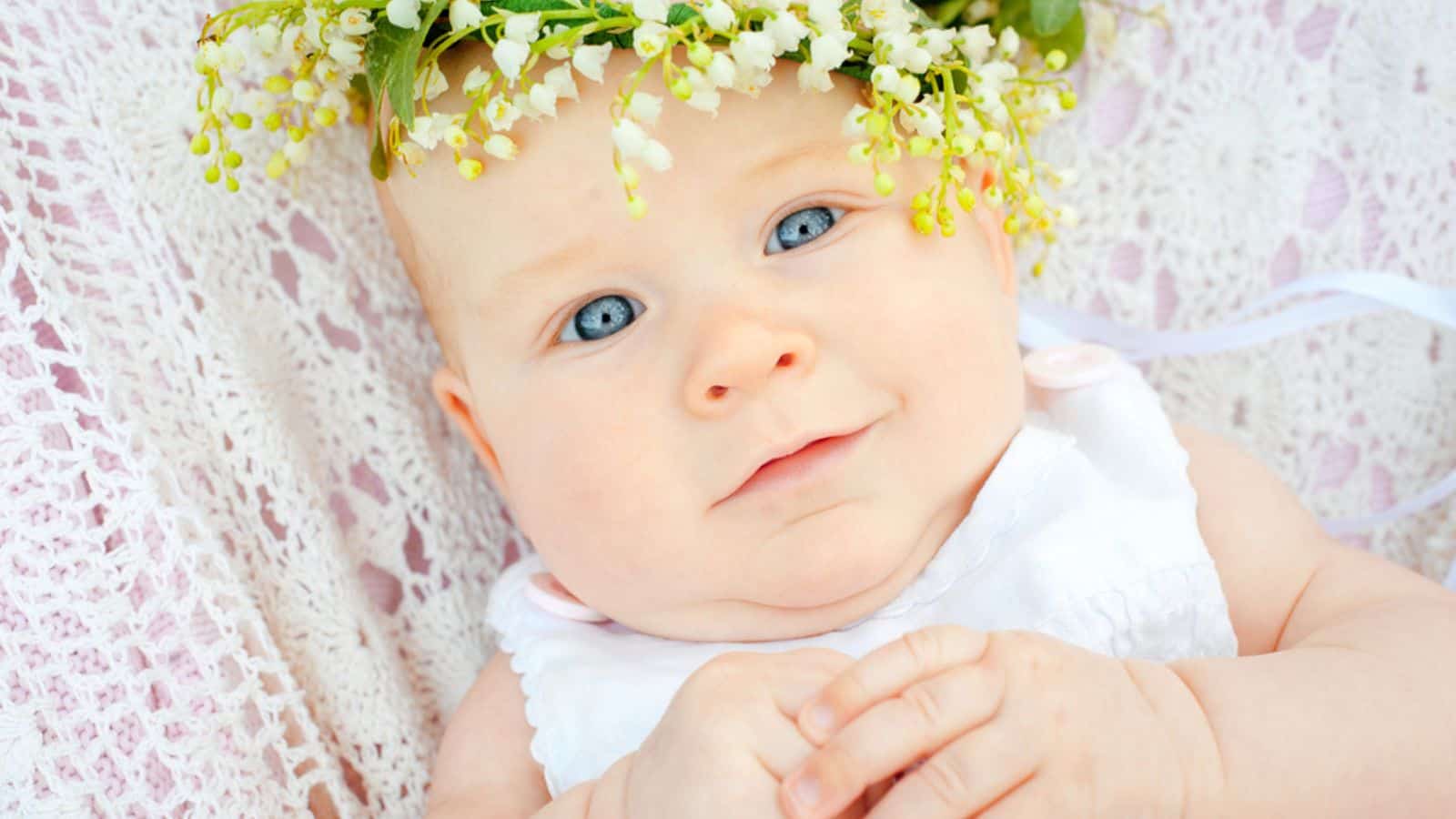 Cute baby and flower lily of the valley.jpg
